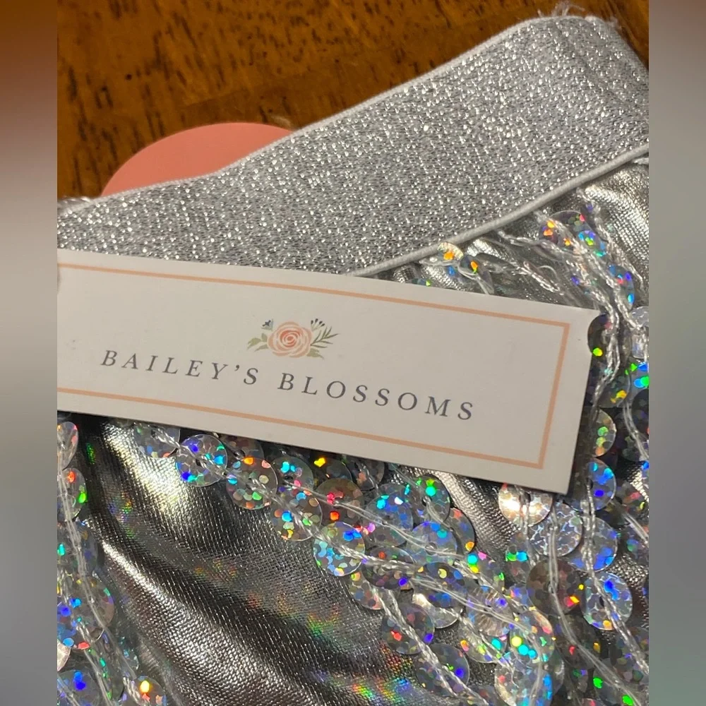 Bailey’s Blossom White ruffled bodysuit top with Sequin Skirt. Size 3–6 months.